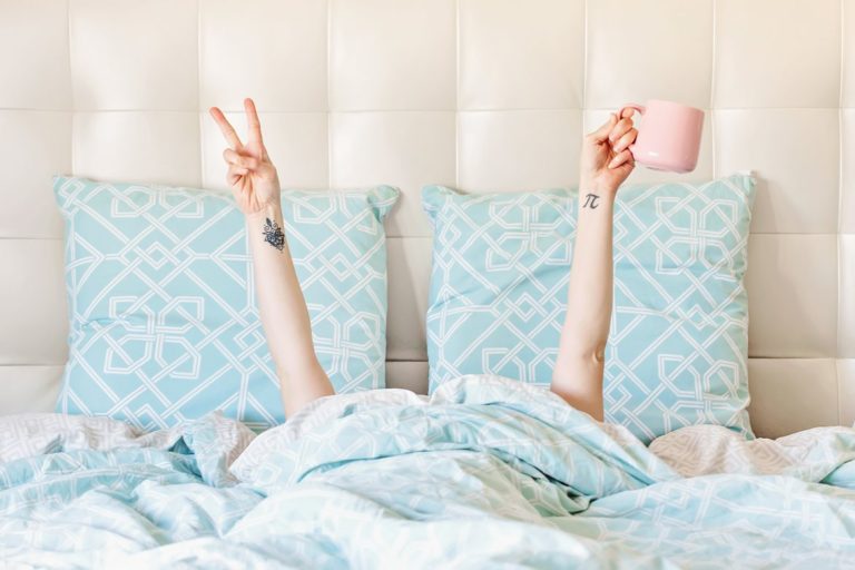 Waking up in bed with arms up - Advice for My 20 Something Self