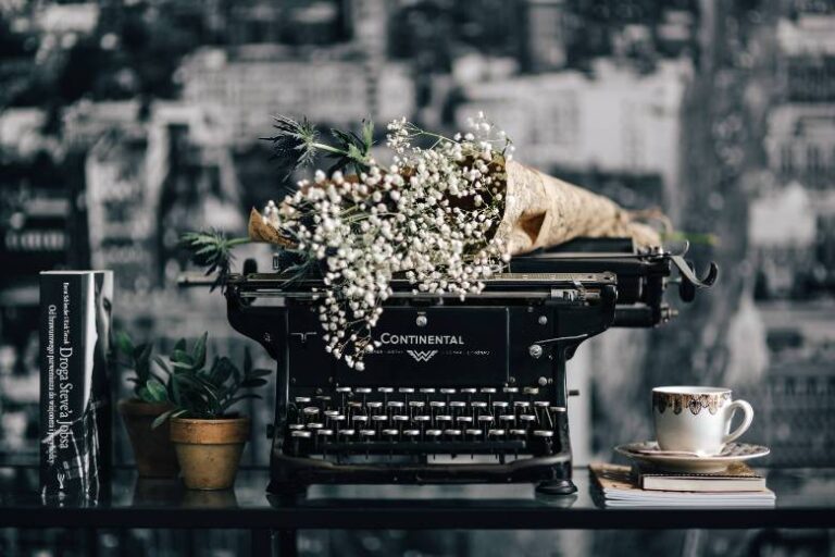 Old vintage typewriter with a bouquet of baby's breath flowers - can't get you off of my mind quotes.