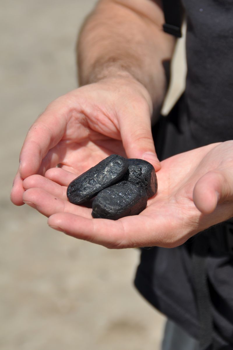 Coal lumps on the beach at Port Burwell Provincial Park
