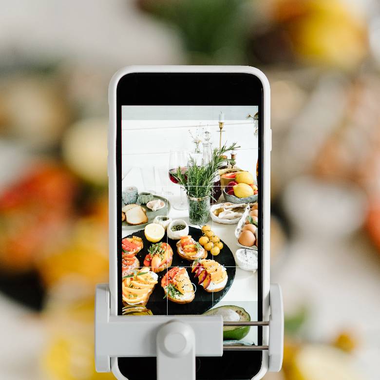 Phone prepared to take a food photo - hobby ideas. 
