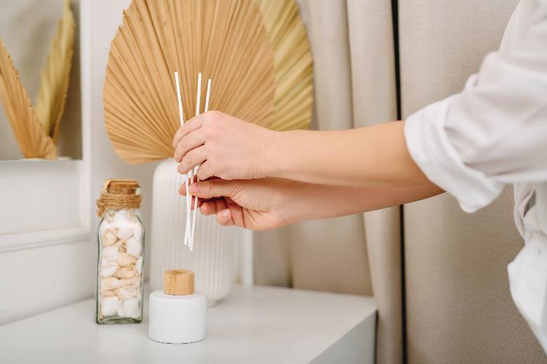 Woman's hands - arranging scent sticks - hobby ideas. 