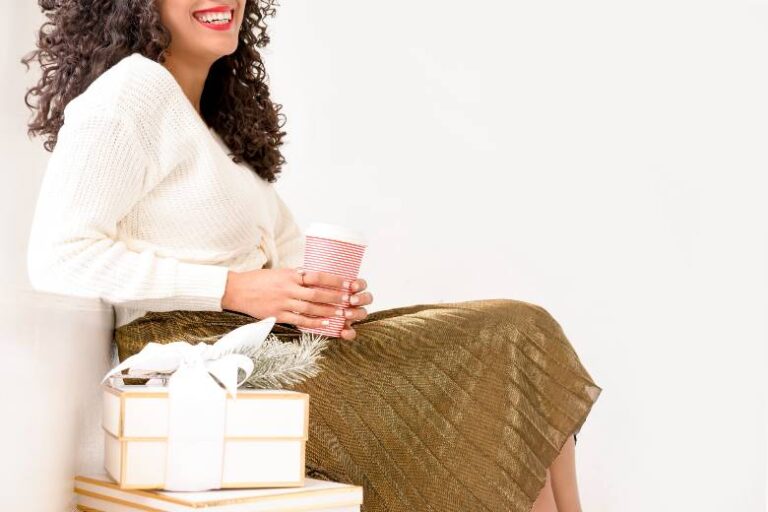 Woman sitting with a gift - hostess gifts.