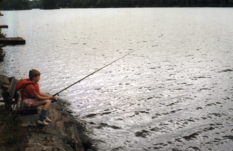 Girl fishing - vintage photo. 